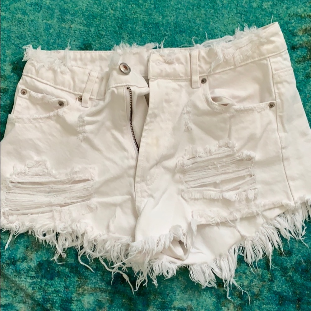 Distressed white denim shorts